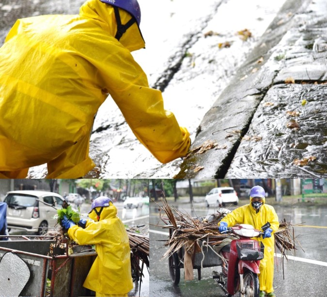 Công nhân môi trường TP. Vinh dầm mưa quét dọn rác, khơi thông cống-4